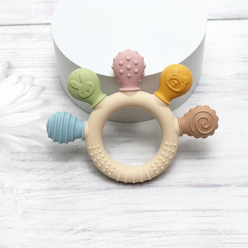 Anneau de dentition à cinq embouts texturés — Coloris pastel